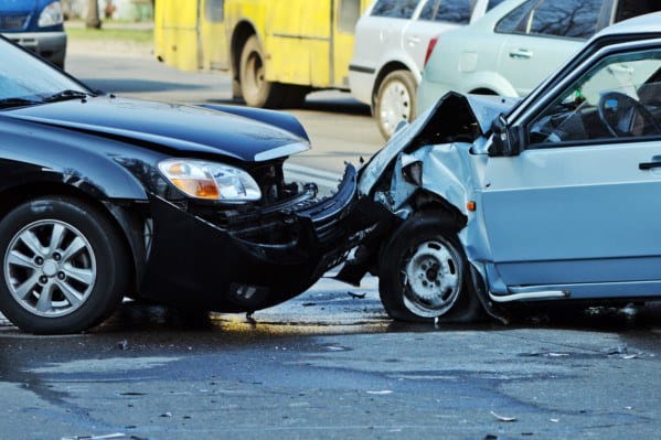 The crushed front bumpers of two cars after an accident